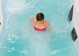 Boy playing with beach ball in the h2x swimspa
